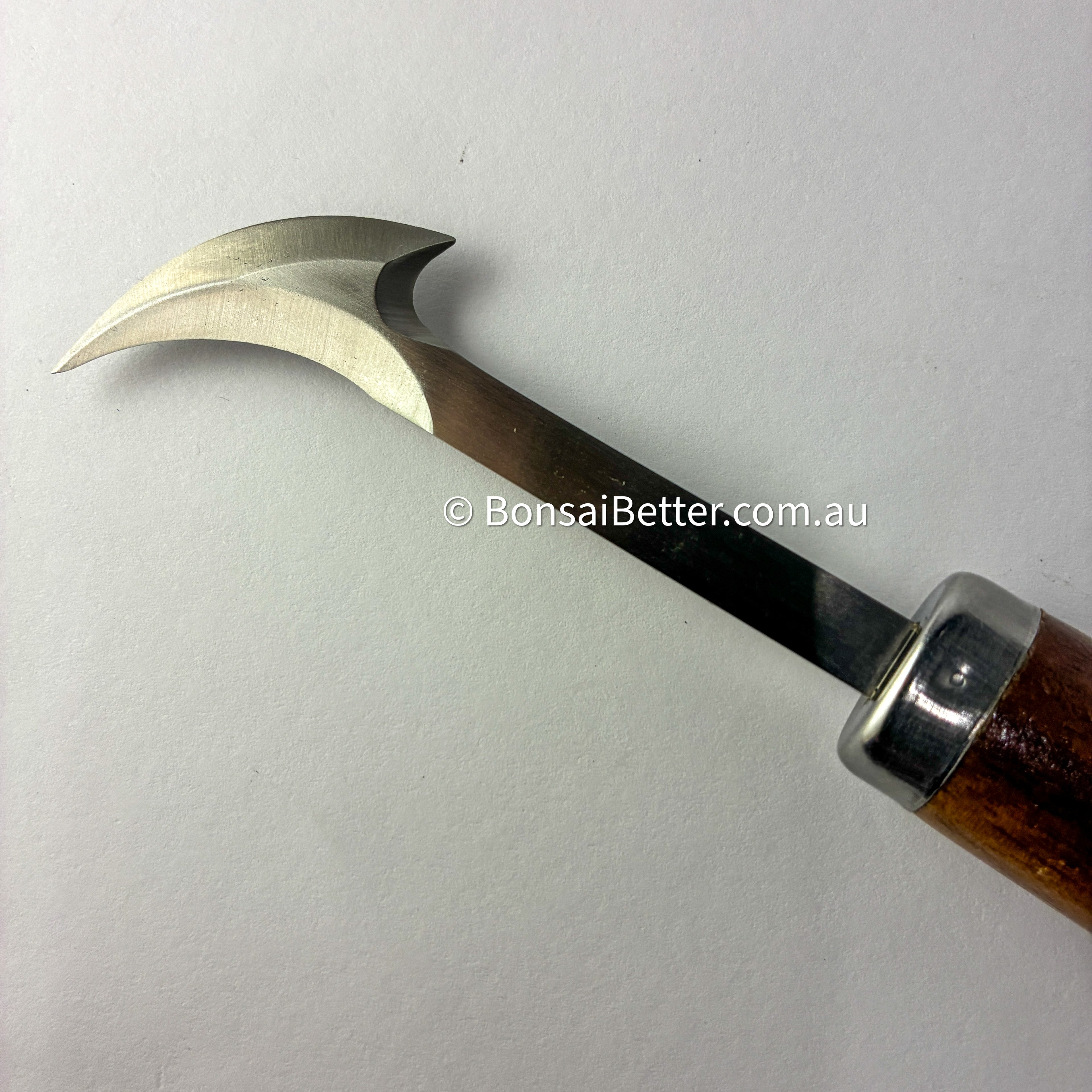 Bonsai carving tool with curved blade and wooden handle on a white background