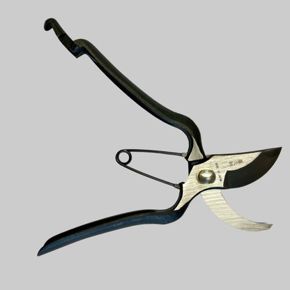 Garden pruner with black handle on a white background